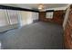 Bright sun room features brick accents, large windows, and neutral carpet at 89 Judy Dr, Martinsville, IN 46151