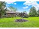 Charming brick house with a large yard, wooden deck, and inviting sunroom at 8906 N County Road 1050 E, Brownsburg, IN 46112