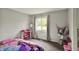 Light-filled bedroom with closet space and window overlooking the backyard for a peaceful retreat at 8906 N County Road 1050 E, Brownsburg, IN 46112