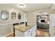 Eat-in kitchen features granite island with seating and access to a living room with a fireplace at 8906 N County Road 1050 E, Brownsburg, IN 46112