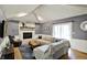 Inviting living room features a fireplace, wood flooring, and sliding glass doors to the backyard at 8906 N County Road 1050 E, Brownsburg, IN 46112