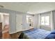 Well-lit main bedroom with wood floors and ensuite access, providing a functional layout at 8906 N County Road 1050 E, Brownsburg, IN 46112