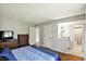 Spacious main bedroom featuring wood floors and an ensuite bath and closet area at 8906 N County Road 1050 E, Brownsburg, IN 46112