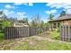 Fenced-in backyard features a detached garage and a view of the main house at 8906 N County Road 1050 E, Brownsburg, IN 46112