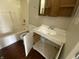Compact bathroom with a vanity, sink, toilet, and tub/shower combination at 9048 E 36Th St, Indianapolis, IN 46235