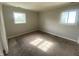 This bedroom features carpeted floors and two windows letting in natural light at 9048 E 36Th St, Indianapolis, IN 46235