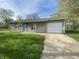 Charming single Gathering home with stone facade, attached garage, and inviting front yard at 9048 E 36Th St, Indianapolis, IN 46235