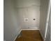 Empty laundry room with utility connections, wire shelving, and flooring at 9048 E 36Th St, Indianapolis, IN 46235