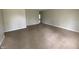 This living room features carpeted floors and neutral paint colors at 9048 E 36Th St, Indianapolis, IN 46235