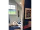 Small bathroom features a toilet, tile flooring, Americana decorations and a window with a view at 911 Centennial Rd, Martinsville, IN 46151