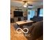Comfortable living room with a sofa, recliner, large coffee table, and mounted television at 911 Centennial Rd, Martinsville, IN 46151