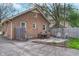 Brick home featuring a patio with outdoor furniture, a grill, and landscaping at 914 Kessler Blvd E Dr, Indianapolis, IN 46220