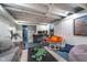 Finished basement with office space, comfortable seating, and open ceiling at 914 Kessler Blvd E Dr, Indianapolis, IN 46220