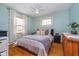 Bright bedroom with ceiling fan, hardwood floors, and window with natural light at 914 Kessler Blvd E Dr, Indianapolis, IN 46220