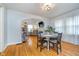 Well-lit dining room offering hardwood floors and an open transition to a bright living room at 914 Kessler Blvd E Dr, Indianapolis, IN 46220