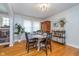 Inviting dining area with a round table, seating for four, and natural light from a nearby window at 914 Kessler Blvd E Dr, Indianapolis, IN 46220
