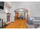 Hardwood floors and an open transition to dining area in a beautifully staged living room at 914 Kessler Blvd E Dr, Indianapolis, IN 46220