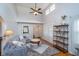 Comfortable living room with high ceilings, a ceiling fan, hardwood floors, and a decorative rug at 914 Kessler Blvd E Dr, Indianapolis, IN 46220