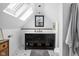 Bright bathroom under skylights with dark vanity and tiled floor, blending style and functionality at 946 Stillwell St, Indianapolis, IN 46202
