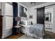 Cozy bedroom featuring natural light, artistic decor, and access to an en-suite bathroom at 946 Stillwell St, Indianapolis, IN 46202
