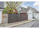 Featuring a privacy fence, gravel landscaping, garage and neighboring homes at 946 Stillwell St, Indianapolis, IN 46202