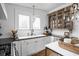 Bright kitchen with white cabinetry, an undermount sink, decorative hardware, and vintage-style accents at 946 Stillwell St, Indianapolis, IN 46202