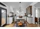 Spacious kitchen with white cabinets, contrasting countertops, an island with seating, and modern appliances at 946 Stillwell St, Indianapolis, IN 46202