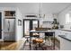 Well-lit kitchen features a central island with seating, stainless appliances, and access to the backyard at 946 Stillwell St, Indianapolis, IN 46202