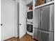 Conveniently located, this space features a stacked washer/dryer and stainless steel refrigerator, maximizing efficiency at 946 Stillwell St, Indianapolis, IN 46202