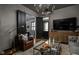 Modern living room featuring a view into a dining room with stylish seating and dark painted walls at 946 Stillwell St, Indianapolis, IN 46202