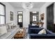 Bright living room featuring modern decor, stylish seating, chandelier, and an open floor plan at 946 Stillwell St, Indianapolis, IN 46202