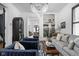 Bright living room features stylish seating, an elegant chandelier, and eye-catching decor at 946 Stillwell St, Indianapolis, IN 46202