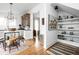 Open-concept living space featuring hardwood floors, a kitchen island, and seamless flow into the living area at 946 Stillwell St, Indianapolis, IN 46202