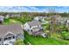 Expansive aerial view of the property highlighting the large yard, tiered deck, and natural surroundings at 10294 Pigato Dr, Zionsville, IN 46077