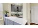 Charming wet bar features cabinetry, backsplash, and countertop space at 10294 Pigato Dr, Zionsville, IN 46077
