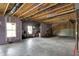 Spacious unfinished basement with exposed ceiling, plumbing, and window for natural light at 10294 Pigato Dr, Zionsville, IN 46077