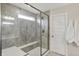 Shower room with a glass door, a glass window, and a built in bench, complete with marble tiled walls at 10294 Pigato Dr, Zionsville, IN 46077