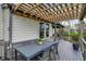 Deck featuring a dining table under a pergola with outdoor seating and a nice view at 10294 Pigato Dr, Zionsville, IN 46077