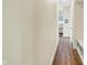 Hallway with wood-look flooring, light colored walls and access to rooms at 10294 Pigato Dr, Zionsville, IN 46077