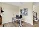 Functional home office space showcasing wood floors, a modern desk setup, and a minimalist aesthetic at 10294 Pigato Dr, Zionsville, IN 46077
