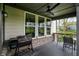 Covered porch with a ceiling fan, featuring an outdoor kitchen with a grill at 10294 Pigato Dr, Zionsville, IN 46077