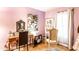 Charming bedroom with hardwood floors, a large window, and comfortable furnishings at 1030 N Butler Ave, Indianapolis, IN 46219