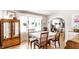 Warm dining room featuring hardwood floors, bright light and classic furnishings at 1030 N Butler Ave, Indianapolis, IN 46219