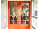 Inviting front door with decorative wreath, adding charm and curb appeal to the home's entrance at 1030 N Butler Ave, Indianapolis, IN 46219