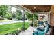 Inviting front porch with comfortable seating, string lights, and decorative iron columns at 1030 N Butler Ave, Indianapolis, IN 46219