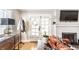 Cozy living room featuring a fireplace, French doors, and stylish decor at 1030 N Butler Ave, Indianapolis, IN 46219