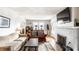 Cozy living room featuring a fireplace, hardwood floors, and comfortable seating at 1030 N Butler Ave, Indianapolis, IN 46219