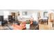 Bright living room with hardwood floors, comfortable seating, and a dining area in the background at 1030 N Butler Ave, Indianapolis, IN 46219