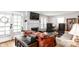 Cozy living room with hardwood floors, comfortable seating, and a fireplace at 1030 N Butler Ave, Indianapolis, IN 46219