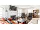 Bright living room with fireplace, comfortable seating, and hardwood floors at 1030 N Butler Ave, Indianapolis, IN 46219